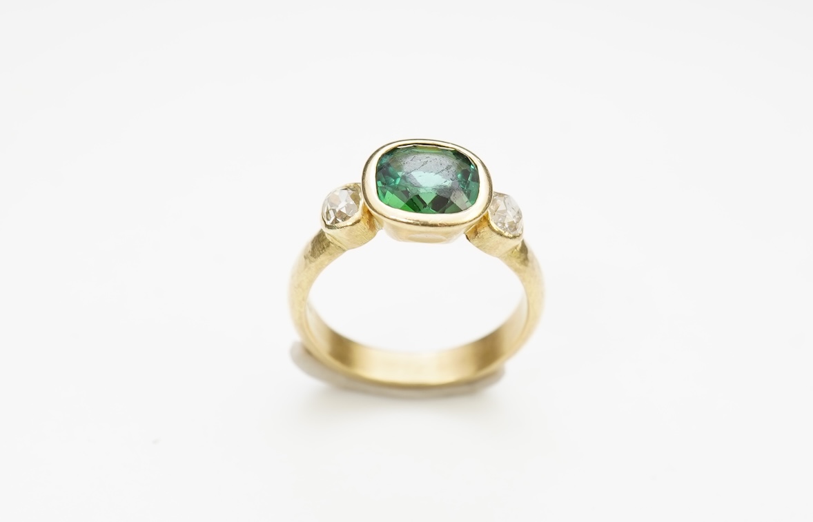 A green tourmaline and diamond ring